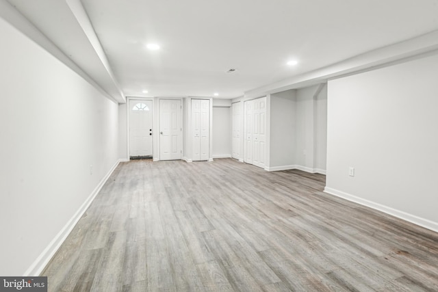 basement featuring light hardwood / wood-style floors