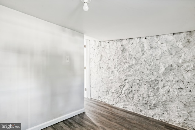 empty room with dark wood-type flooring