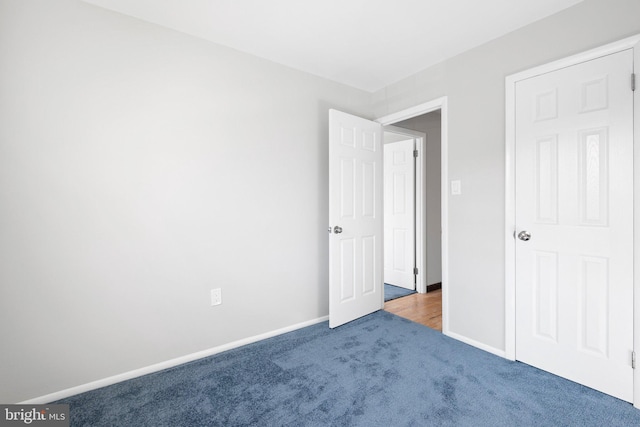 unfurnished bedroom featuring carpet flooring