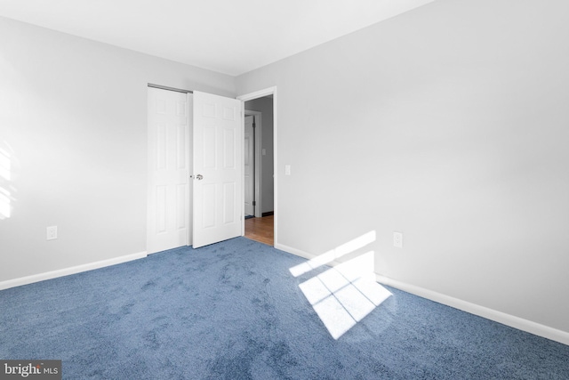 interior space featuring dark colored carpet