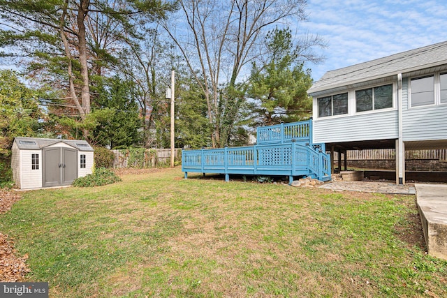 view of yard with a storage shed and a deck