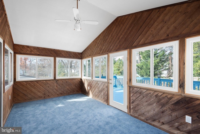 unfurnished sunroom with plenty of natural light, ceiling fan, and lofted ceiling