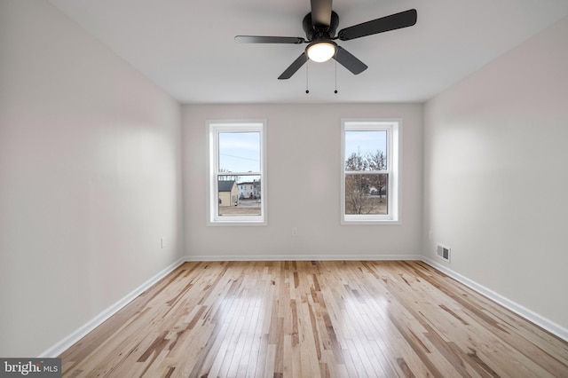 unfurnished room with ceiling fan and light hardwood / wood-style flooring