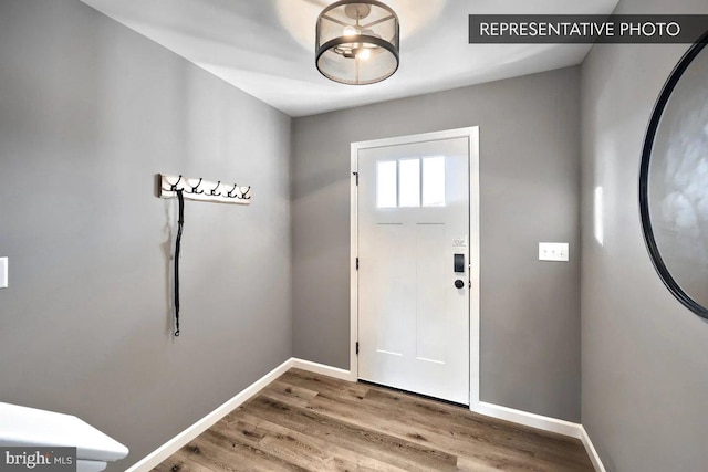 entrance foyer featuring hardwood / wood-style floors