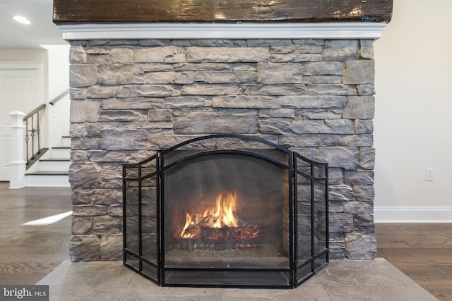 details featuring a fireplace and hardwood / wood-style floors