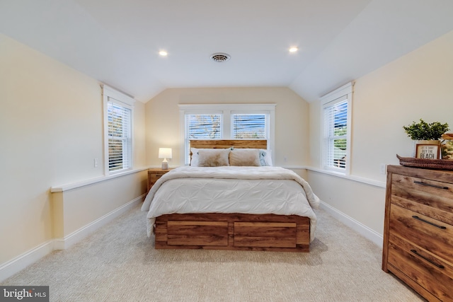 carpeted bedroom featuring lofted ceiling