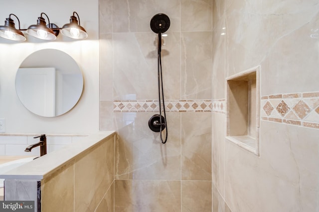 bathroom with tiled shower