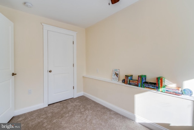 rec room with light colored carpet