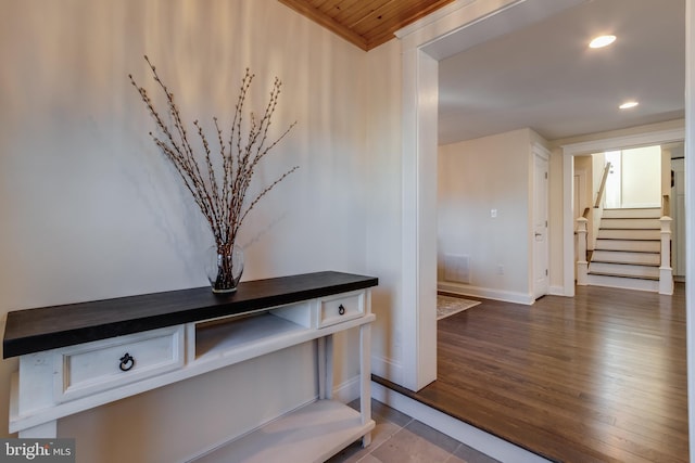 interior space with hardwood / wood-style floors and wooden ceiling