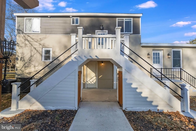 entrance to property with a patio