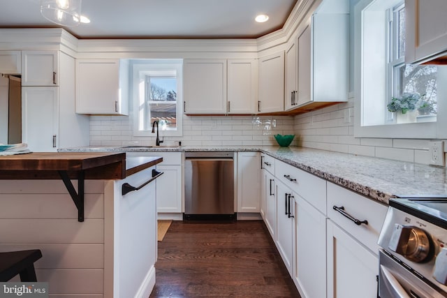 kitchen featuring dishwasher, sink, light stone counters, dark hardwood / wood-style flooring, and white cabinets