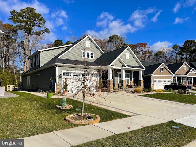 craftsman house with a front lawn and covered porch