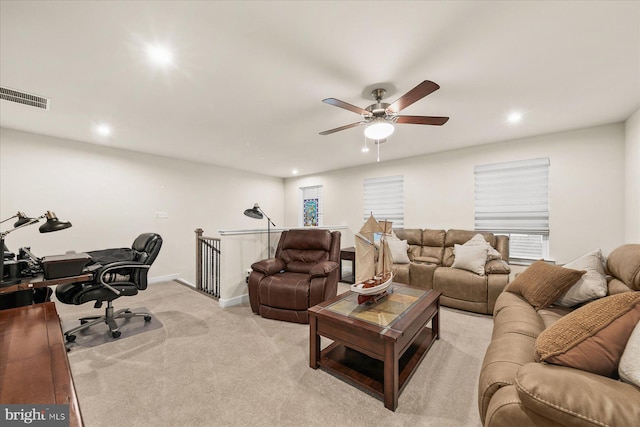 living room with light carpet and ceiling fan