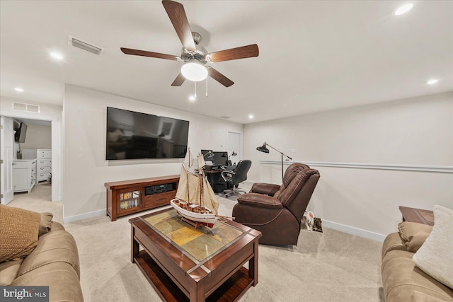 living room with light carpet and ceiling fan