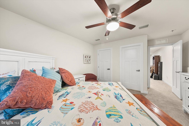 bedroom with light carpet and ceiling fan