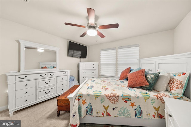 bedroom featuring ceiling fan and light colored carpet