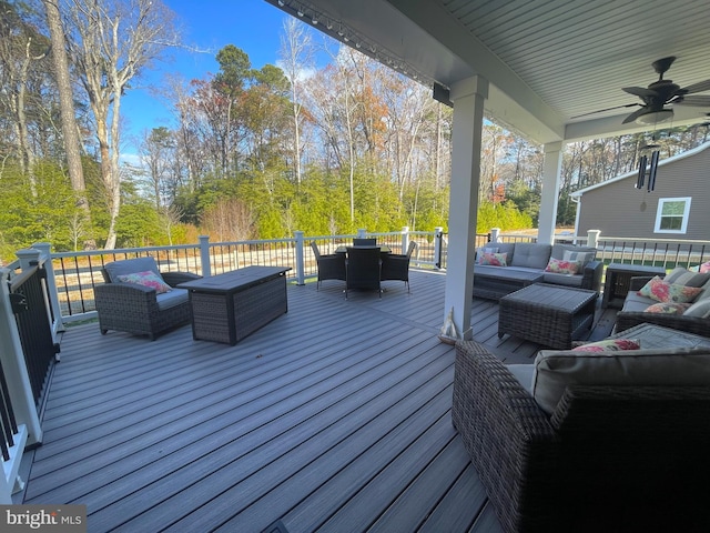 deck featuring an outdoor hangout area and ceiling fan