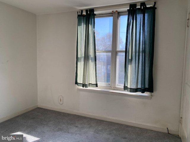 unfurnished room with carpet floors