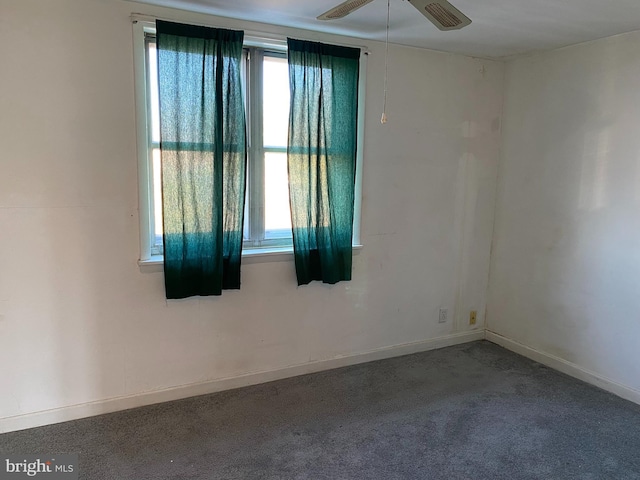 empty room featuring ceiling fan and carpet floors