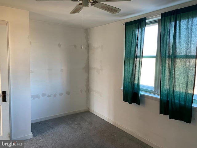 carpeted empty room with ceiling fan