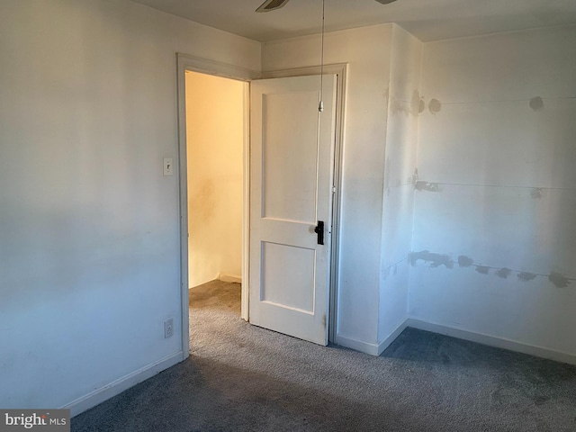 empty room with carpet floors and ceiling fan