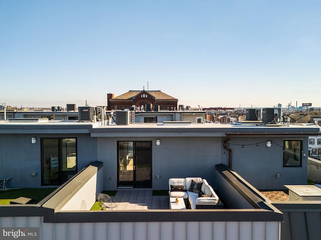 rear view of property featuring a balcony