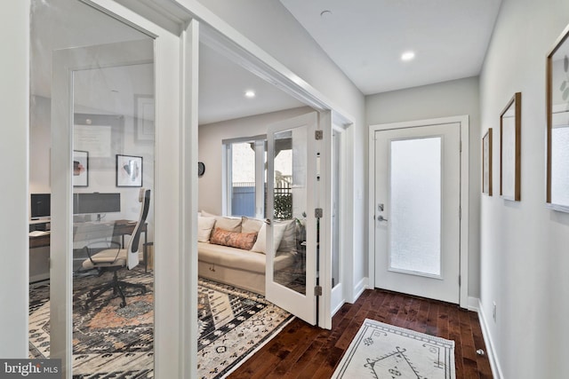 doorway to outside with dark wood-type flooring