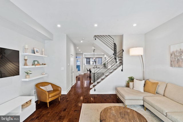 living room with dark hardwood / wood-style floors