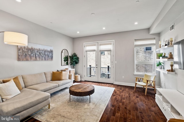 living room featuring french doors and dark hardwood / wood-style flooring