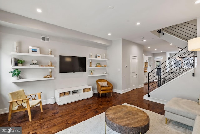 living room with dark hardwood / wood-style flooring