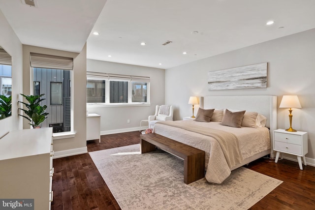 bedroom featuring dark hardwood / wood-style flooring