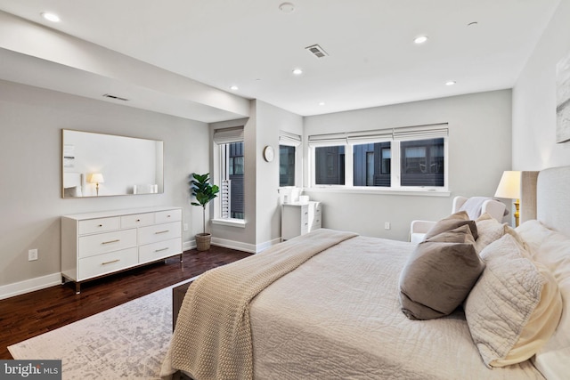 bedroom featuring dark hardwood / wood-style flooring