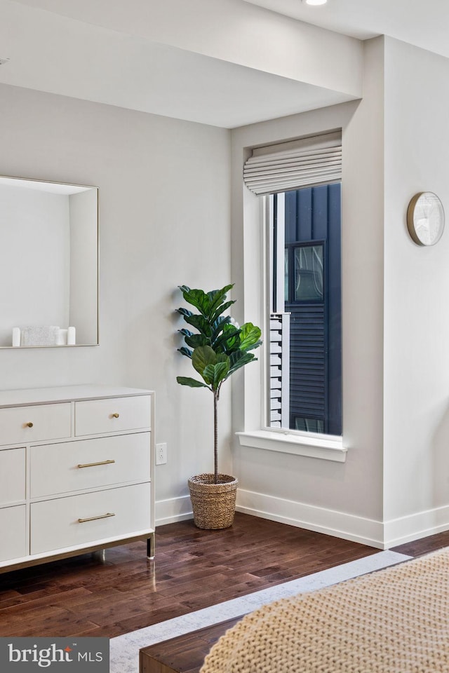 unfurnished bedroom featuring dark hardwood / wood-style floors