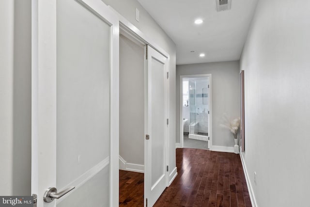 corridor featuring dark hardwood / wood-style floors