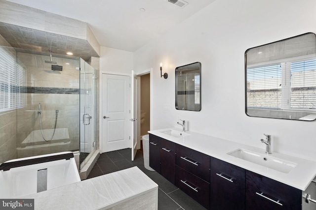 bathroom featuring tile patterned flooring, vanity, and an enclosed shower