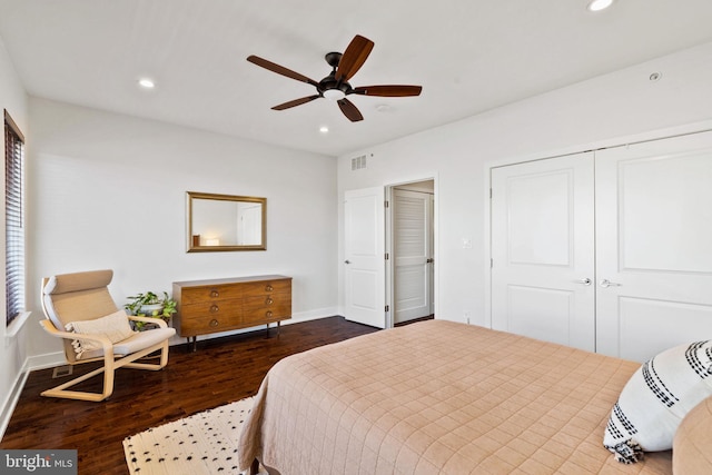 bedroom with ceiling fan and dark hardwood / wood-style floors