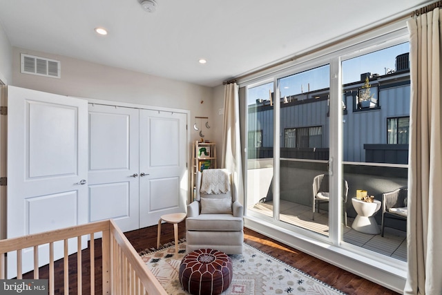 bedroom with wood-type flooring and a closet