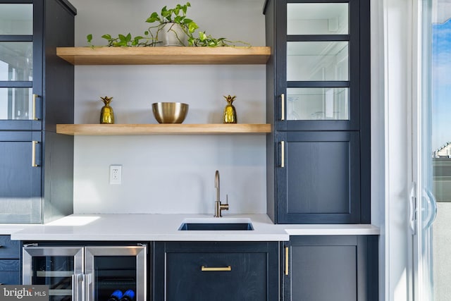 bar with sink and beverage cooler