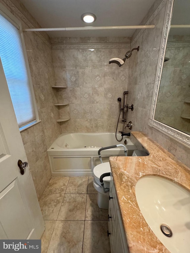 full bathroom with tile patterned floors, vanity, toilet, and tiled shower / bath combo