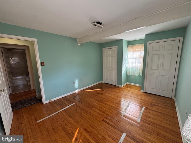 unfurnished bedroom featuring hardwood / wood-style floors