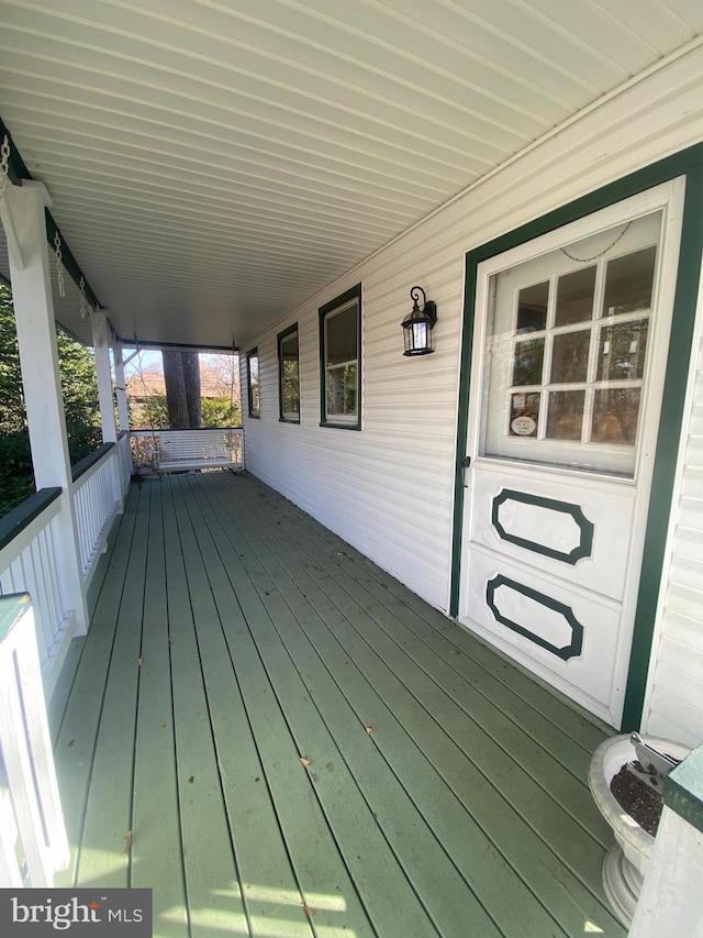 wooden deck featuring covered porch