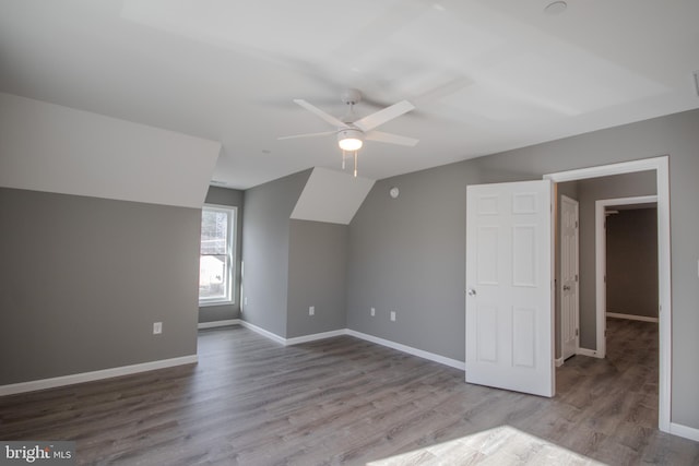 bonus room with ceiling fan, lofted ceiling, and light hardwood / wood-style flooring