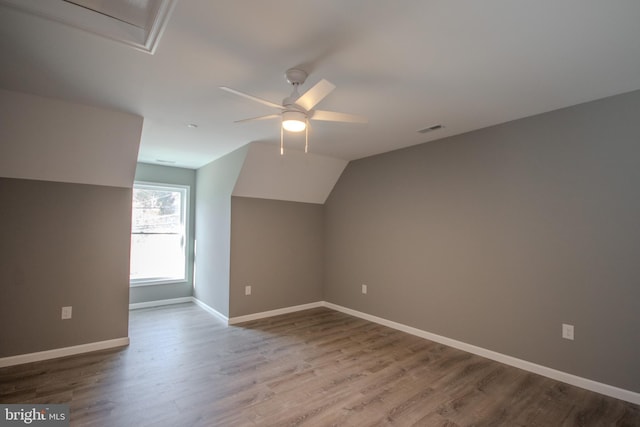 bonus room featuring hardwood / wood-style flooring, ceiling fan, and lofted ceiling