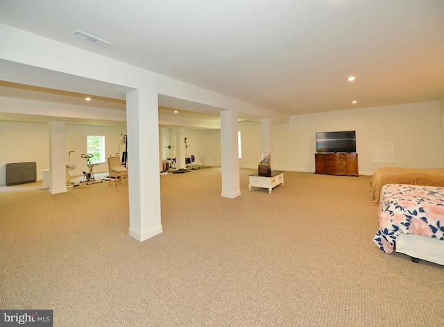 bedroom featuring light colored carpet