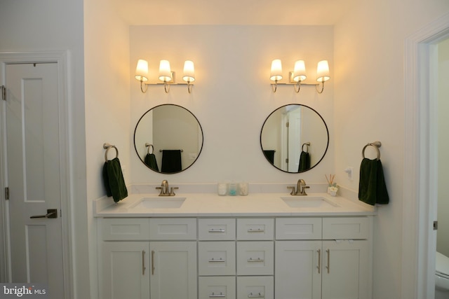 bathroom featuring toilet and vanity