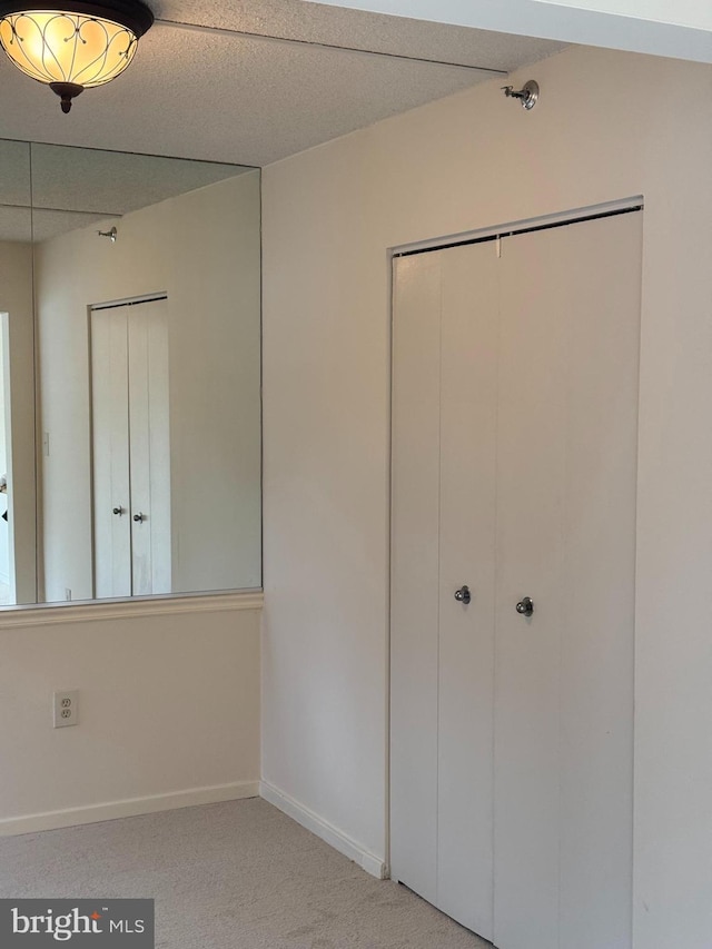 unfurnished bedroom featuring carpet flooring