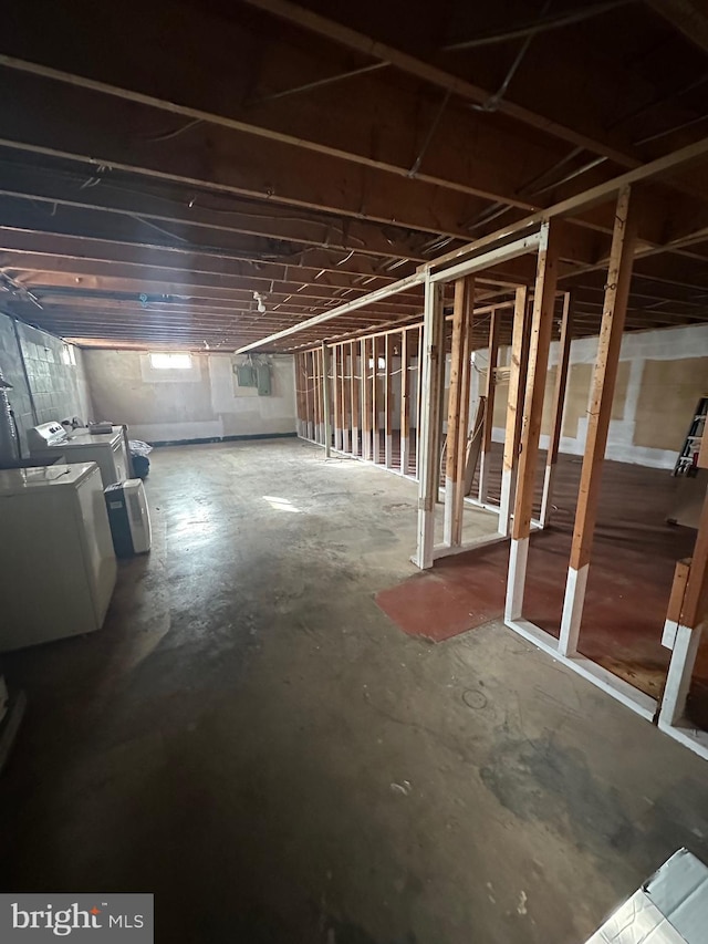 basement with washing machine and clothes dryer