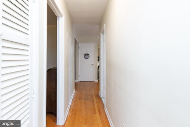 hall with light wood-type flooring