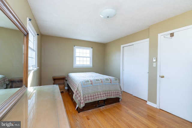 bedroom with light wood-type flooring