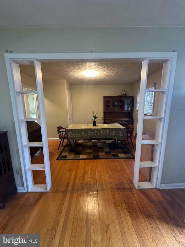 dining area featuring wood-type flooring